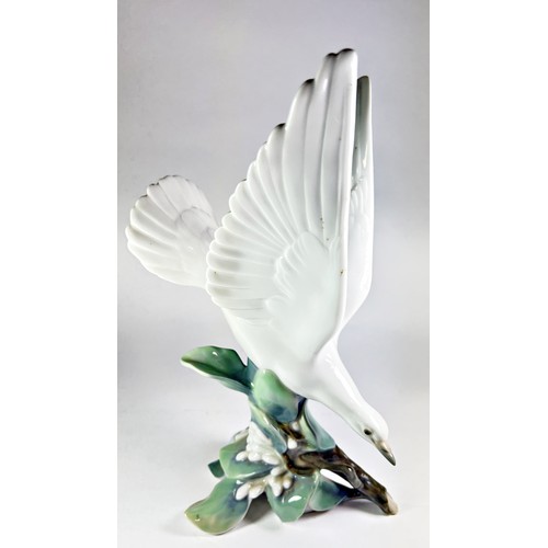 34 - A Lladro figure of a dove on bough, no 4550