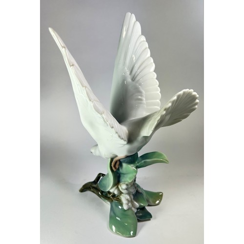 34 - A Lladro figure of a dove on bough, no 4550