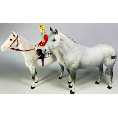 51 - Four Beswick figures to include a racehorse and jockey, further grey stallion, Hereford bull and a f... 