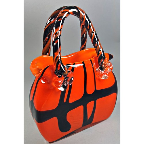 171 - A decorative glass handbag in a black and tangerine finish