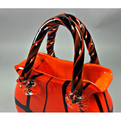 171 - A decorative glass handbag in a black and tangerine finish