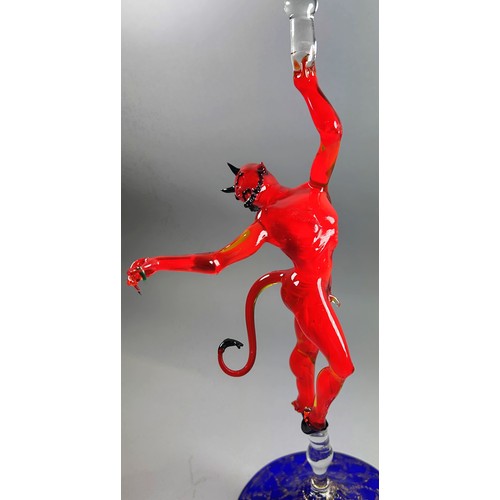 189 - A glass candlestick with red devil and an alabaster nude (2)