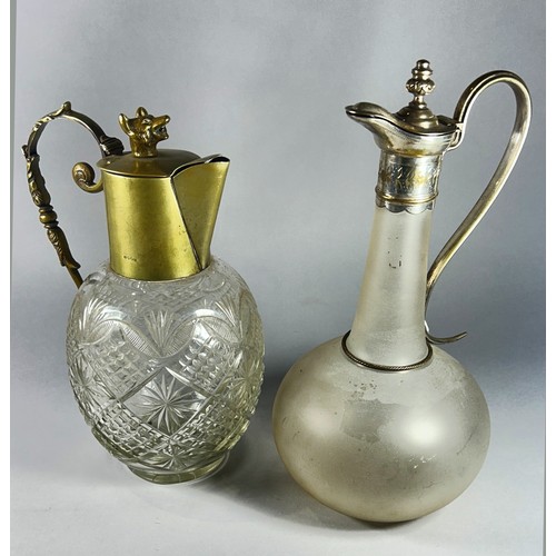 211 - A cut glass claret jug with fox head lid, together with a frosted glass claret jug with a serpentine... 