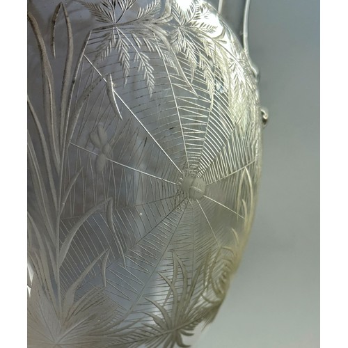 212 - A late 19th century etched glass ewer decorated with flowers and butterflies, 29cm tall.