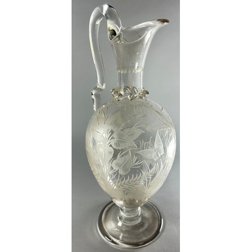 212 - A late 19th century etched glass ewer decorated with flowers and butterflies, 29cm tall.