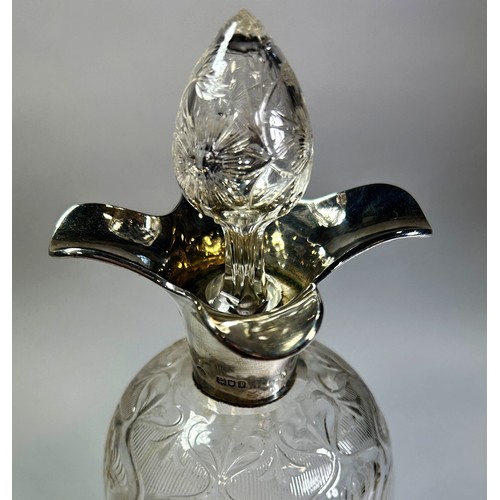 213 - A silver neck floral designed glass decanter, London, 1904, makers William Comyns & Sons, 30cm H