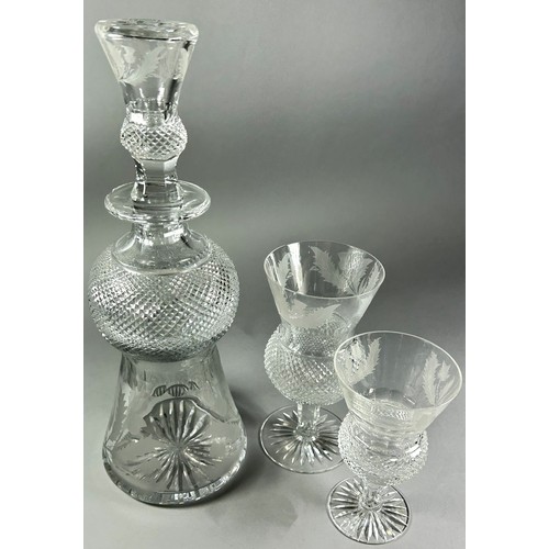 214 - A cut glass thistle shaped decanter and cut glasses