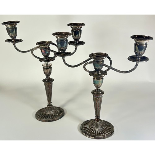 254 - A pair of silver plated Regency style candelabra with a central sconce flanked by two scrolled branc... 