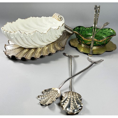 257 - A shell shaped ceramic salad bowl on a silver plated wave base, complete with serving spoons, togeth... 