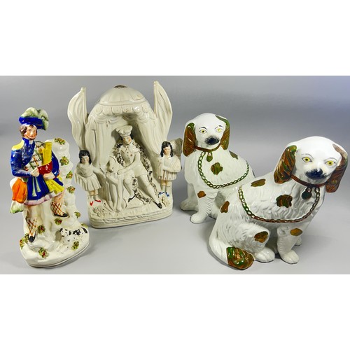 110 - A 19th century Staffordshire flatback group of the Highland Musician, a Pair of Staffordshire dogs w... 