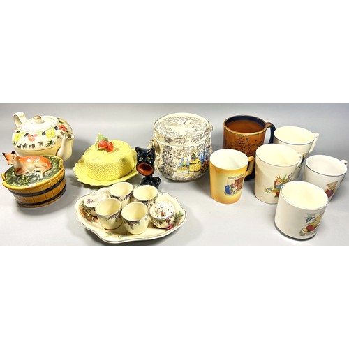 107 - A mixed collection of ceramics to include nursery wares, Crown Ducal egg cup set, Oxo mug etc