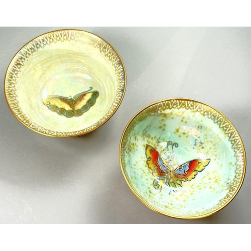 127 - Wedgwood lustre - Two open bowls, similar exterior with mottled tangerine, with either butterfly or ... 