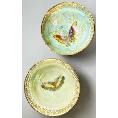 127 - Wedgwood lustre - Two open bowls, similar exterior with mottled tangerine, with either butterfly or ... 