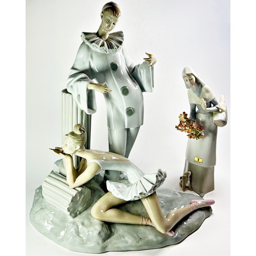 49 - A Lladro group, male character standing above a ballerina (af) together with one further Lladro figu... 