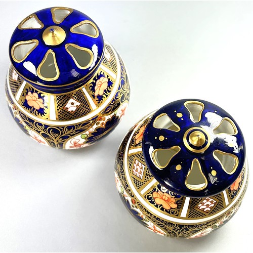 120 - Royal Crown Derby - a pair of pot pourri vases and pierced covers, globular shape with cigar pattern... 