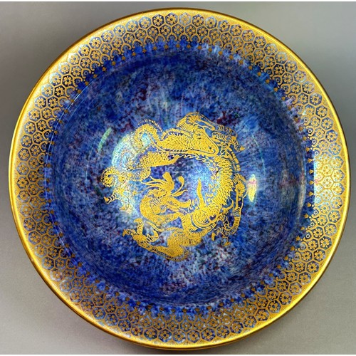 137 - Wedgwood lustre - flared bowl, the exterior with mottled tangerine overlaid with gilded dragons, the... 