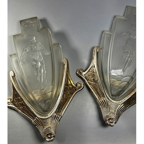 209 - A Pair of Art Deco frosted glass wall lights with the figure of Theros held in silver plated wall mo... 