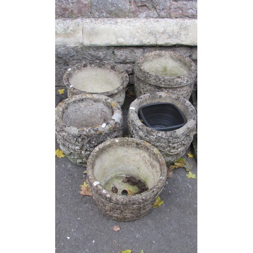 1001 - Five weathered composition stone circular  garden planters with relief detail, the tallest example 3... 