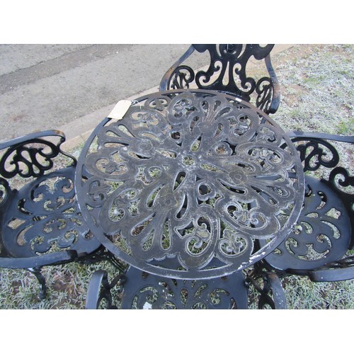 1008 - A mat painted five piece cast alloy garden terrace set with decorative pierced scrolling and foliate... 