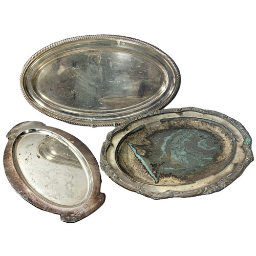 277 - A selection of five silver plated trays or serving plates of varying size.