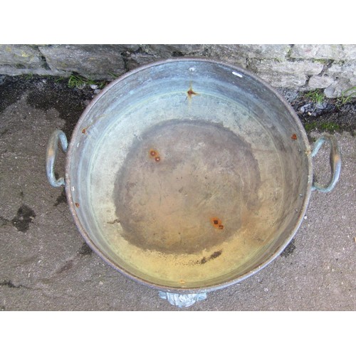 1035 - A large weathered/patinated copper circular pan/cauldron with loop handles and later lions mask fitt... 