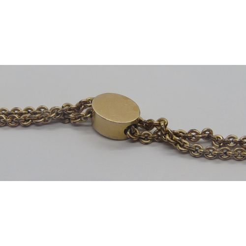 301 - Antique gilt metal long guard chain necklace with engraved pearl set slider, 66cm L approx