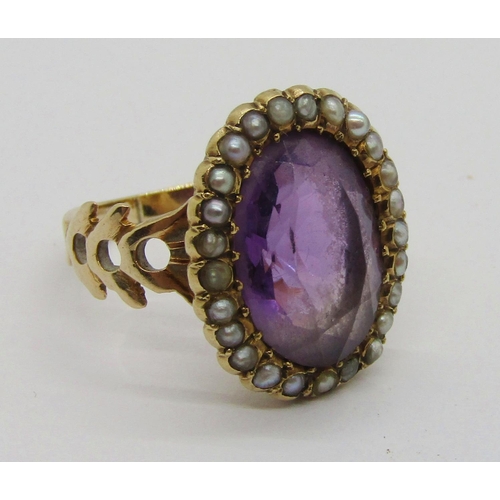 310 - Antique yellow metal amethyst and seed pearl oval cluster ring with pierced shoulders, size J, 4.8g