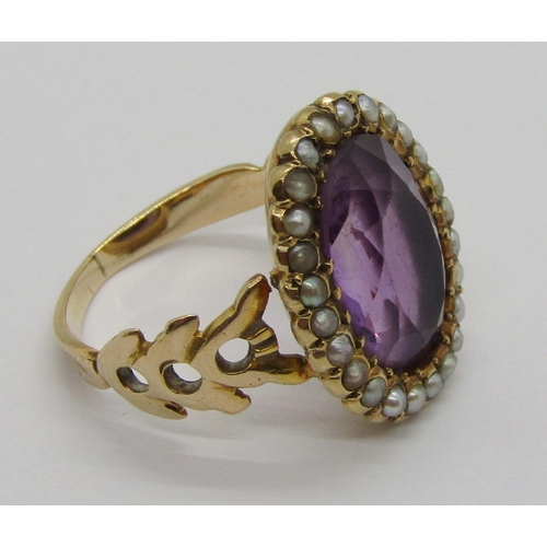 310 - Antique yellow metal amethyst and seed pearl oval cluster ring with pierced shoulders, size J, 4.8g