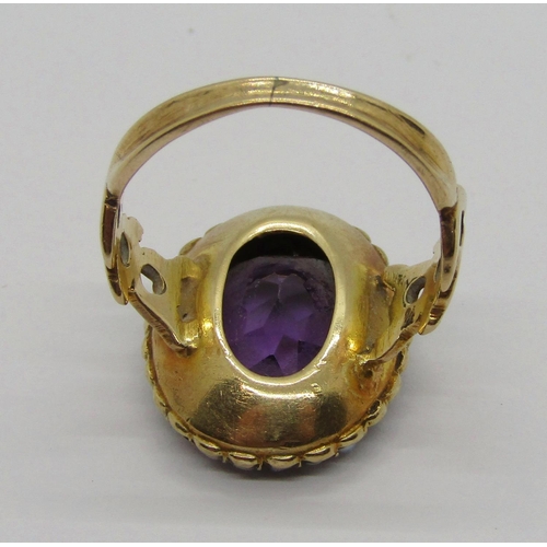 310 - Antique yellow metal amethyst and seed pearl oval cluster ring with pierced shoulders, size J, 4.8g