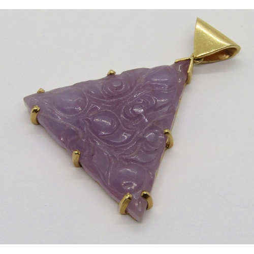 311 - 14k carved lavender jade pendant of triangular form, 3.4cm L approx, 7.6g