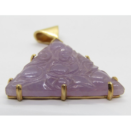 311 - 14k carved lavender jade pendant of triangular form, 3.4cm L approx, 7.6g