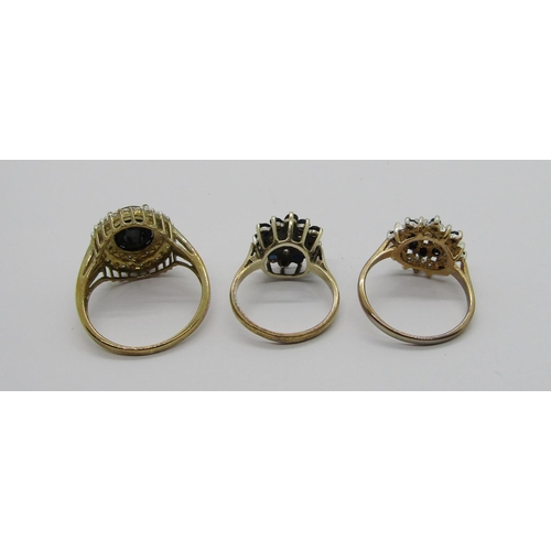 314 - Two sapphire and diamond cluster dress rings, 6.5g total and a further silver gilt sapphire and simu... 