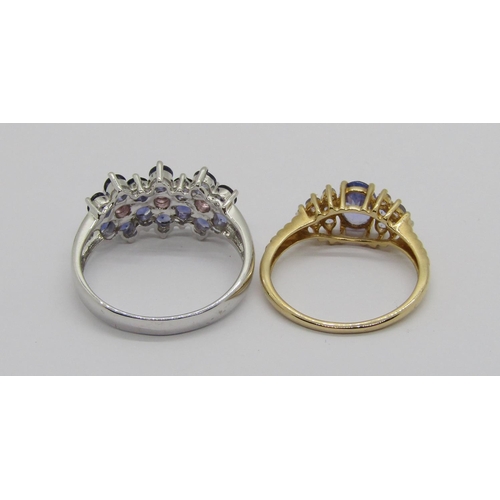 317 - Two tanzanite dress rings; a 14k white gold floral cluster example, size S and a Danbury Mint 14ct c... 