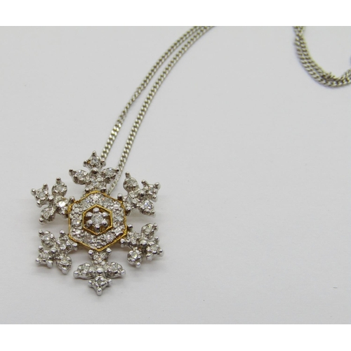 319 - 9ct white gold diamond snowflake pendant necklace, together with a 9ct diamond cluster ring, size N,... 