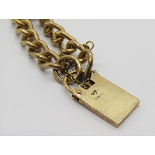 321 - 9ct curb link bracelet with padlock clasp, maker 'R&CLd', London 1973, 23g