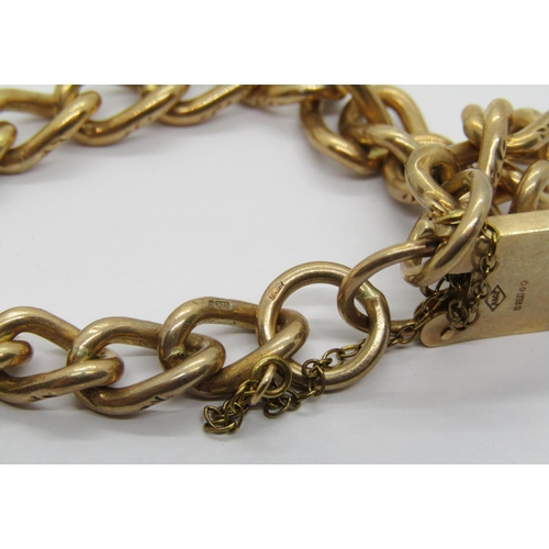 321 - 9ct curb link bracelet with padlock clasp, maker 'R&CLd', London 1973, 23g