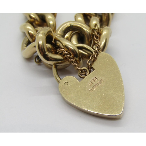 324 - Heavy vintage 9ct curb link bracelet with heart padlock clasp, maker 'PBC', Birmingham, 61.9g