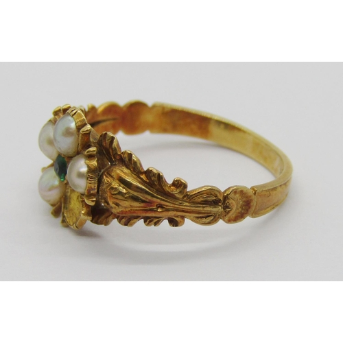 328 - 19th century yellow metal mourning ring set with a floral cluster of pearls and small emerald to cen... 