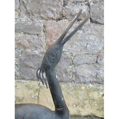 1050 - A contemporary weathered cast bronze garden ornament in the form of a stork,  95 cm high