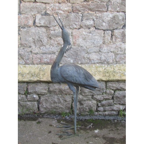 1050 - A contemporary weathered cast bronze garden ornament in the form of a stork,  95 cm high