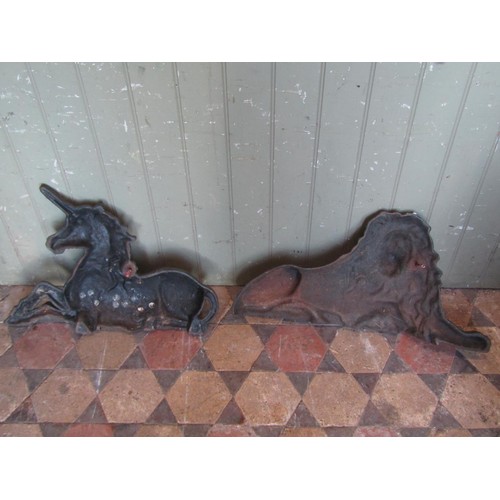 1052 - A pair of Country House cast iron lion and unicorn door porters, the unicorn 41 cm high x 60 cm, the... 