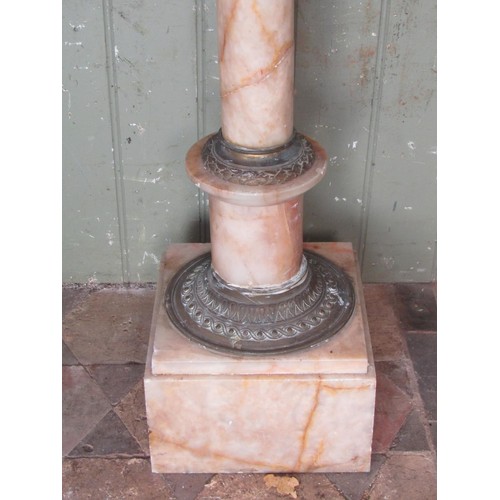 1056 - An alabaster pedestal, the square bevelled top raised on a simple turned pillar with cast gilt metal... 