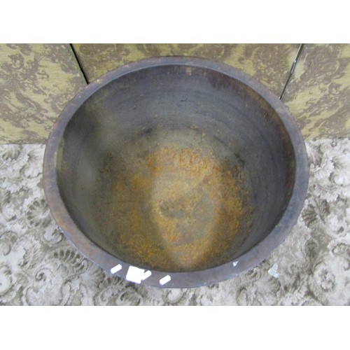 1088 - A large antique cast iron cauldron with flared rim and rounded bottom, 53 cm high x 75 cm diameter