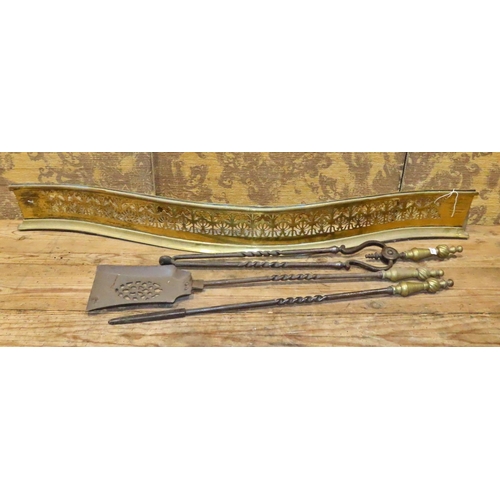 1082 - A 19th century brass serpentine fire fender with fretwork grill, together with a set of iron and bra... 