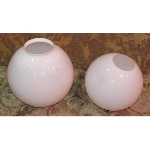 1102 - Two milk glass globular  shades, the largest example approximately 30 cm diameter