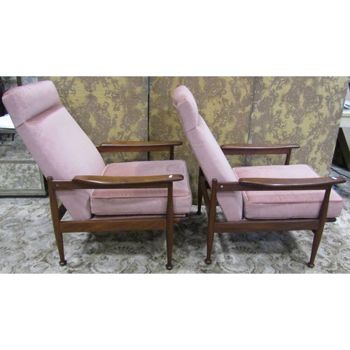 1111 - A pair of good quality mid 20th century teak framed lounge chairs with open shaped arms, raised on s... 