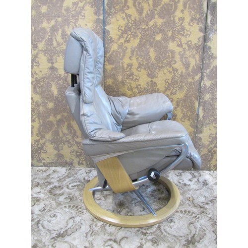 1116 - An Ekorness Stressless swivel and adjustable lounge chair and matching stool with soft leather uphol... 