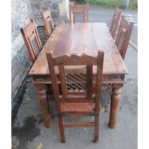 1139 - A large eastern hardwood dining table and together with six associated dining chairs