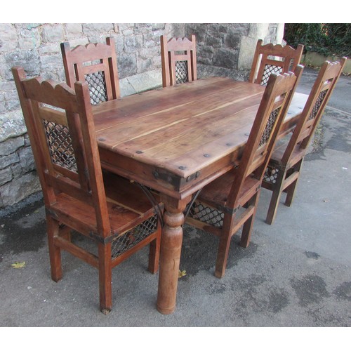 1139 - A large eastern hardwood dining table and together with six associated dining chairs