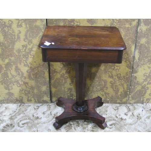 1143 - A 19th century rosewood table of rectangular form with frieze drawer raised on a tapered octagonal p... 